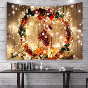 Detail of Christmas tapestry featuring glowing wreath and festive red stockings on a wall