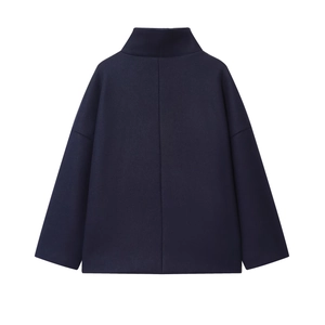 Rear view of deep blue high-neck wool coat with dropped shoulder silhouette and thick fabric
