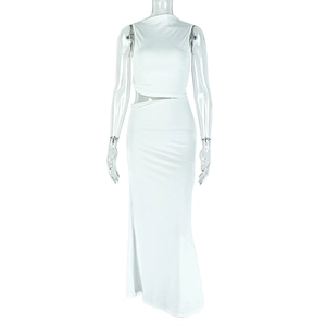 Detailed close-up of white knitted crop top and bodycon skirt set on mannequin