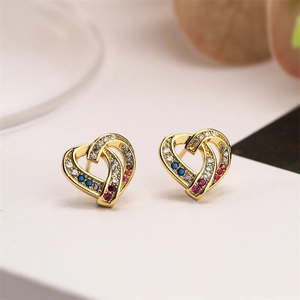 Detail of gold-plated heart studs with hollow design and colorful zircon inlay stones