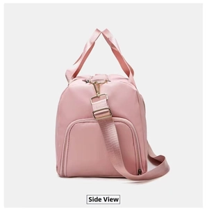 Side view of pink yoga travel bag showing side zipper pocket and metal hardware detail