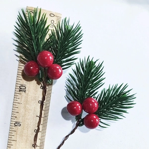 Detailed view of 10cm artificial pine needles with red berries for Christmas DIY decor