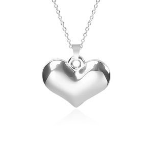 Polished silver heart pendant necklace detail with 18k plating and thin link chain