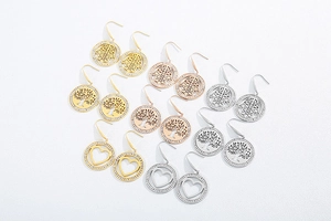 Detail view of round pavé rhinestone earrings in gold, rose gold, and silver finishes