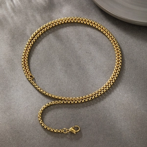 Detailed view of a 14k gold box chain necklace with a secure lobster clasp closure