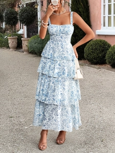 Detail of blue and white floral chiffon midi dress with layered ruffles and straps