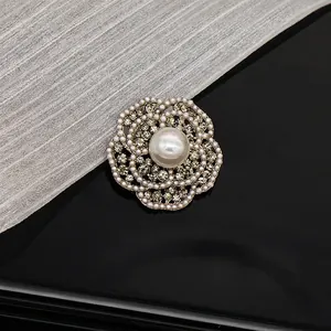 Close-up of vintage floral brooch with micro pearls and crystal inlay Style D