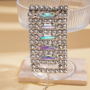 Macro shot of silver bracelet with iridescent crystals and shimmering rhinestones detail