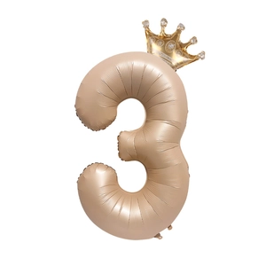 Detailed view of champagne gold number 3 balloon with crown for birthday party decor