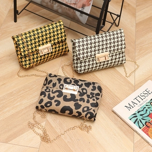 Chic houndstooth and leopard print crossbody bags with elegant metal chain straps