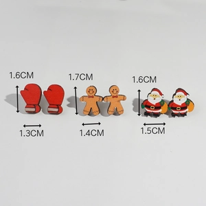 Detailed view of wooden Christmas studs featuring gloves, gingerbread man and Santa Claus