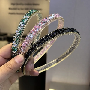 Detail view of crystal headbands with anti-slip teeth and colorful gemstones