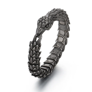 Punk style eagle head open cuff bracelet in vintage silver finish with feathered texture