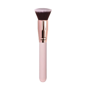 Detailed macro view of soft flat top blush brush with rose gold ferrule and pink handle