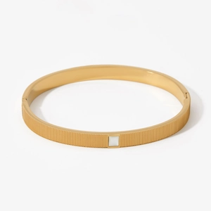 Gold minimalist stainless steel bracelet with square white shell inlay and striped texture