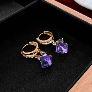 Vintage golden drop earrings with purple zircon gemstone and luxury crystal accents
