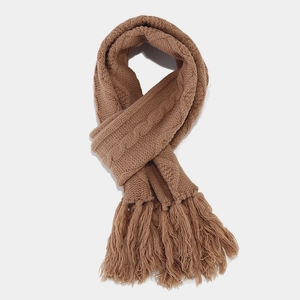 Three-piece winter knit set with thick cable knit scarf, hat and gloves in caramel brown