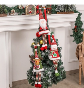 Hanging knitted Christmas dolls featuring Santa, deer, and pine on a decorated tree