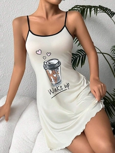 Detail of coffee print and wavy hem on white camisole nightdress for women