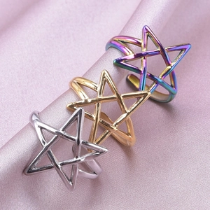 Adjustable 304 stainless steel star rings in silver, gold, and rainbow finishes on satin
