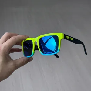 Macro side view of matte black sunglasses temples with relief logo and gradient frame details