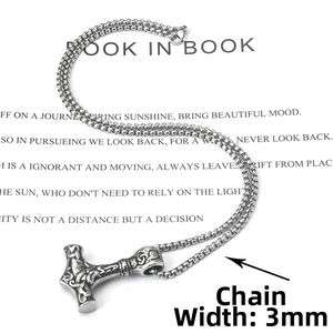 Detail view of Mjölnir pendant with vintage engravings and a 3mm pearl chain link