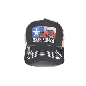 Detailed close-up of Texas truck embroidery on a black and beige mesh trucker hat