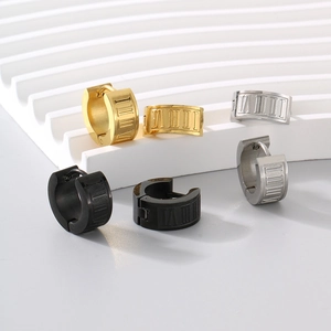 Detailed view of hinged hoop earrings with Roman numerals in gold, silver, and black finish