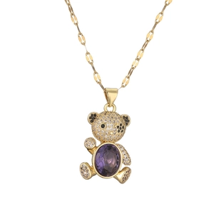 Golden necklace with cute bear pendant featuring purple zircon and micro-set stones