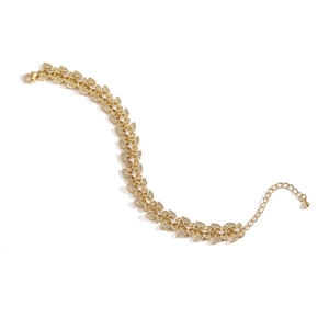 Detailed close-up of golden butterfly link bracelet with shimmering zircon stones and clasp