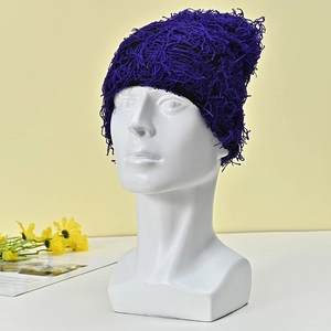 Detail of purple feathered yarn knit beanie showing fluffy mesh texture and warm fabric