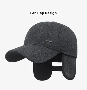 Detailed side view of dark grey winter baseball cap with ear flaps and SPORT metal tag