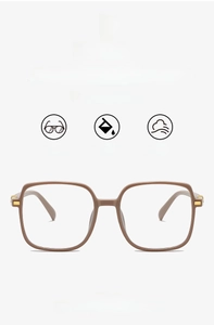 Detail of matte brown square frame eyewear with golden metal hinge hinge and 18g lightweight