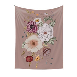 Detailed texture of wall hanging tapestry with hand-drawn floral patterns on soft pink fabric