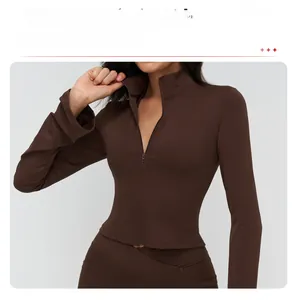 Detail of slim-fit athletic jacket with full-zip stand collar and sleek coffee brown fabric