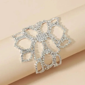Hollow flower sparkling rhinestone cuff bracelet in silver finish for elegant evening wear