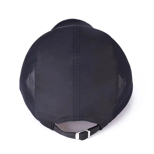 Detail of black baseball cap showing breathable mesh panels and adjustable metal buckle