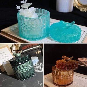 Detail of vintage relief jewelry boxes with diamond patterns and bird handle lids