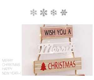 Detail of wooden Christmas tree hanging with LED lights and Merry Christmas typography