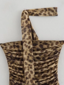 Detail of leopard print halter top showing pleated fabric and neckline strap craftsmanship