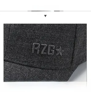 Detailed close-up of dark grey denim baseball cap with RZG star embroidery