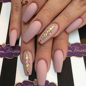 Matte pink long coffin press-on nails with luxury gold studs and colorful rhinestones