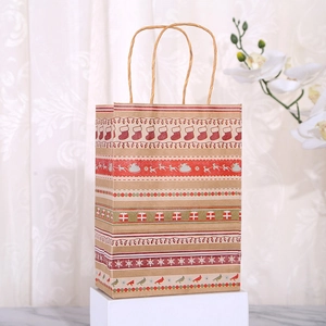 Detail of brown kraft gift bag with festive reindeer and snowflake patterns on a pedestal