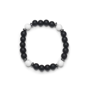 Matte black stone and white turquoise beaded bracelet with hematite spacers on white background
