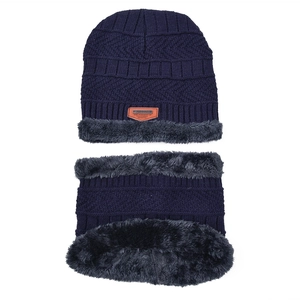 Detail of the navy blue knitted hat and scarf set with thick grey faux fur lining