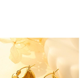 Detail of elegant 18K gold plated question mark ring displayed with dried flowers