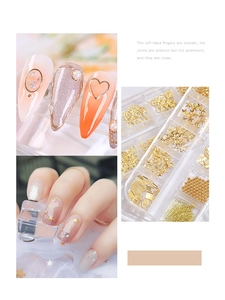 Close-up of gold and silver metal nail charms and rhinestones with application on nails