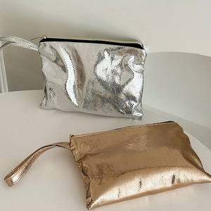 Detailed view of silver and rose gold metallic snakeskin PU leather makeup pouches