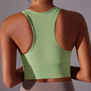 Macro detail of the sage green Y-back seamless sports bra featuring a wide elastic band