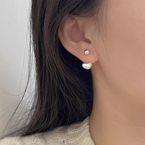 Detail of S925 sterling silver ear jacket with heart-shaped drop and polished bead stud